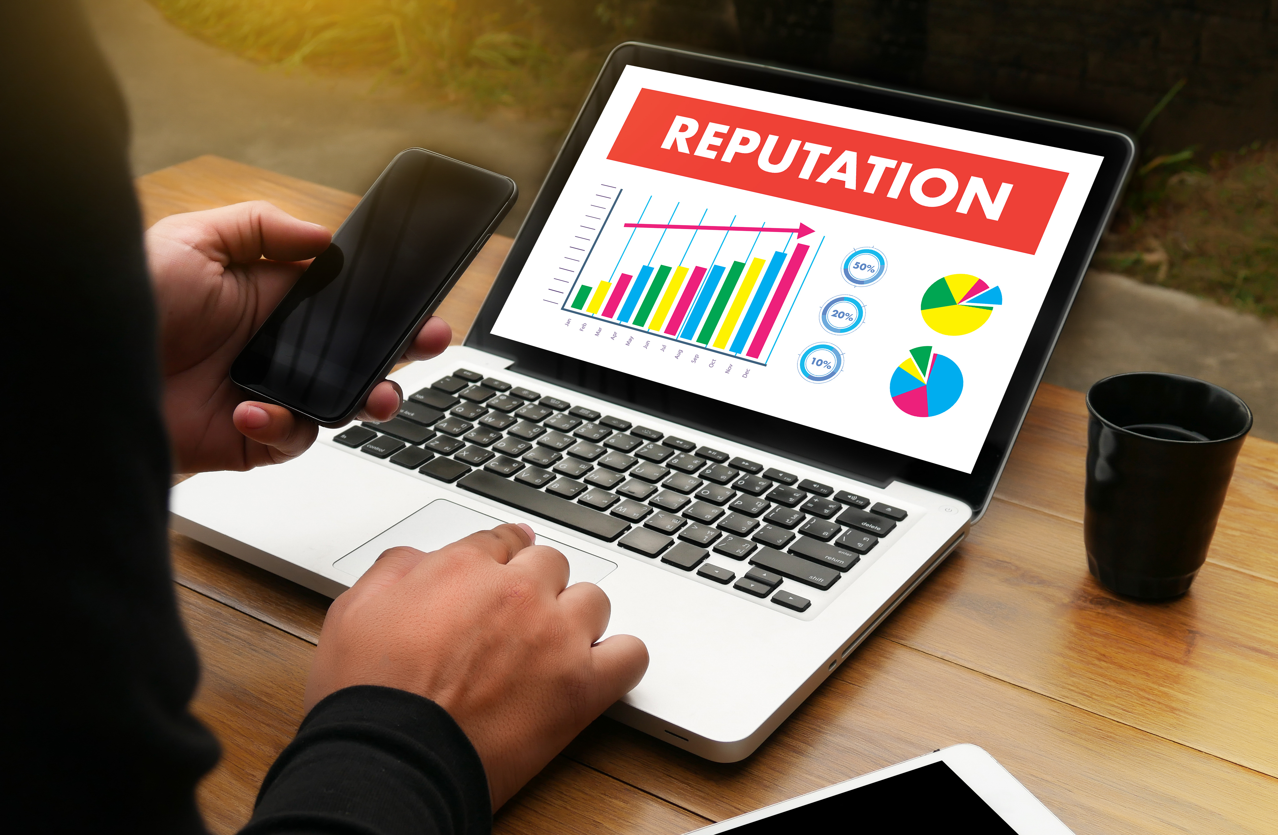 A laptop showing a business's increase in reputation